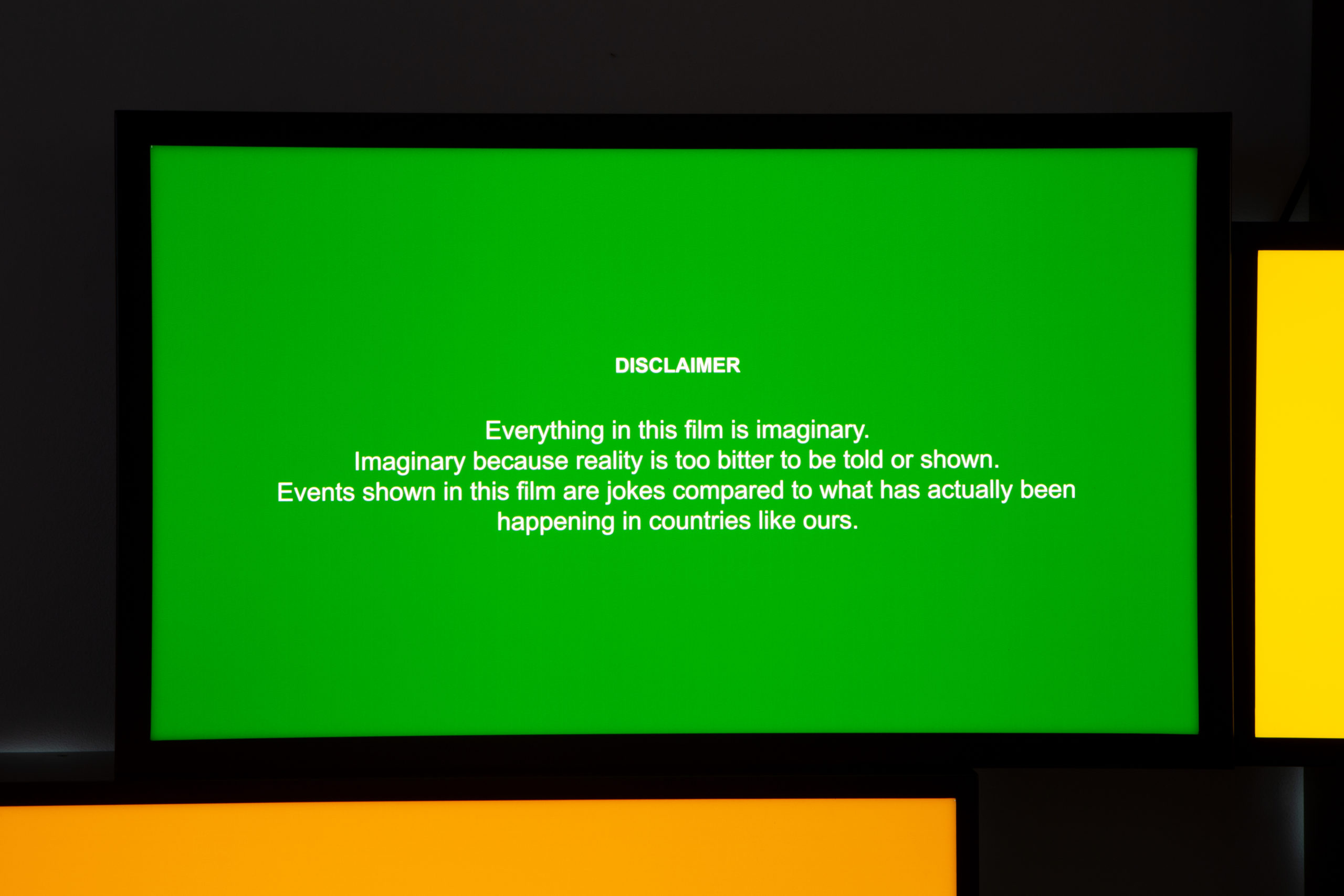 green lightbox with text againt wall