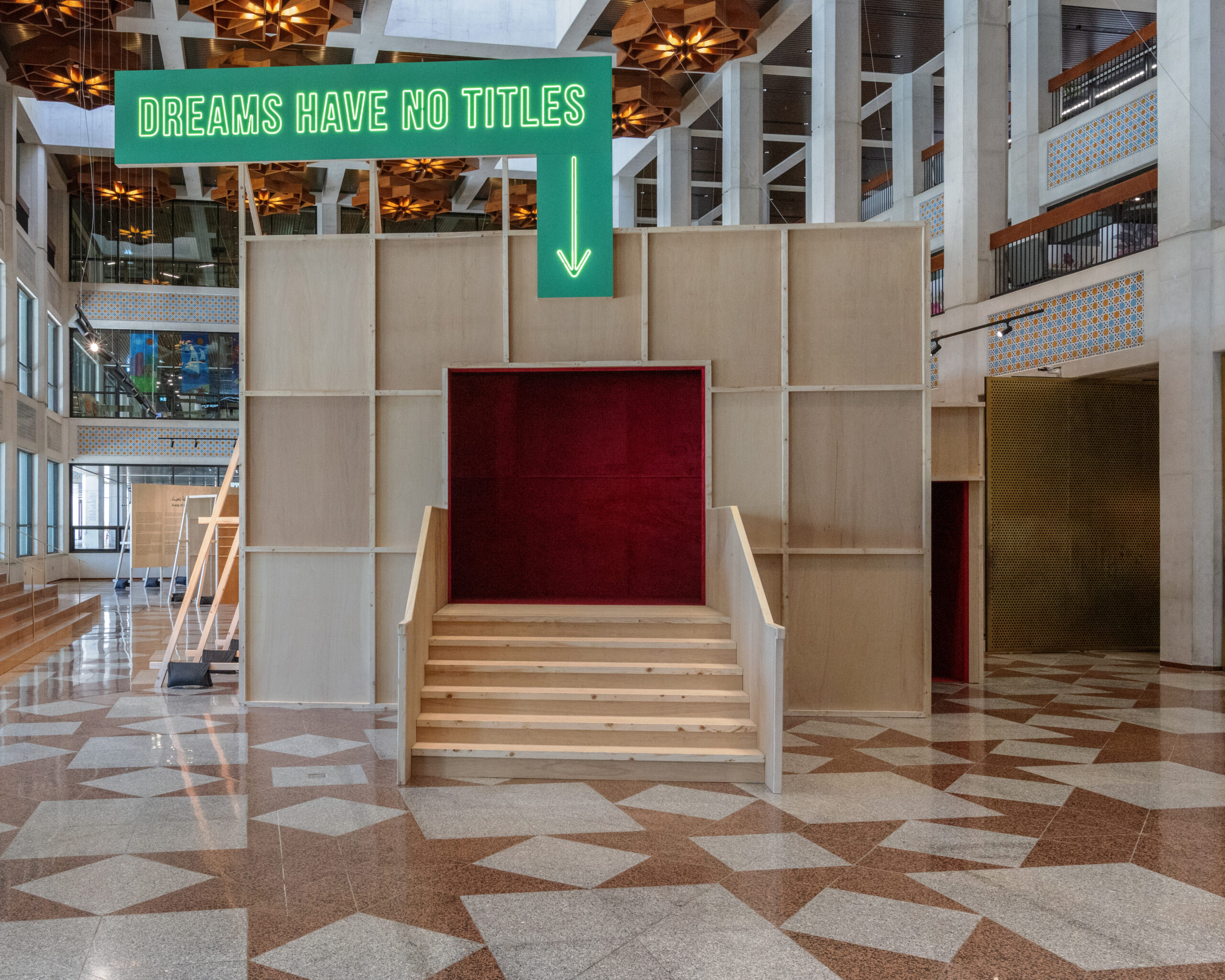 cinema in wood with green neon light english text
