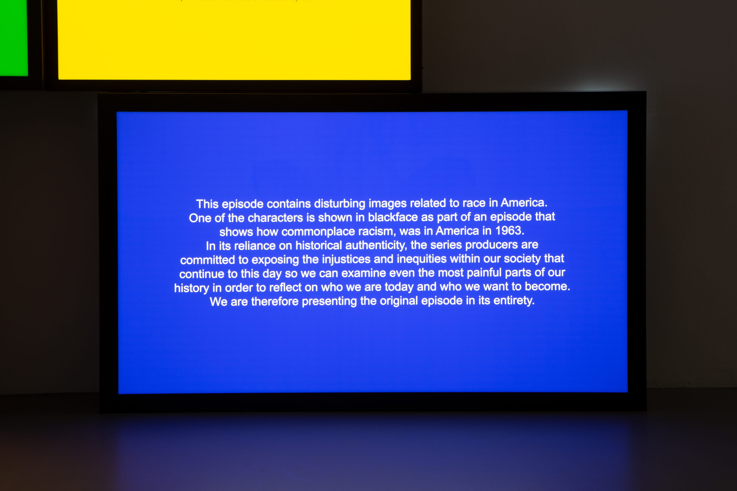 blue lightbox with text against wall